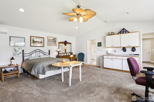 bedroom with light carpet, lofted ceiling, a wall unit AC, a sink, and recessed lighting