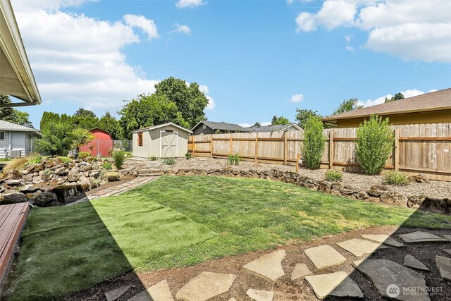 view of yard with a storage unit and an outdoor structure