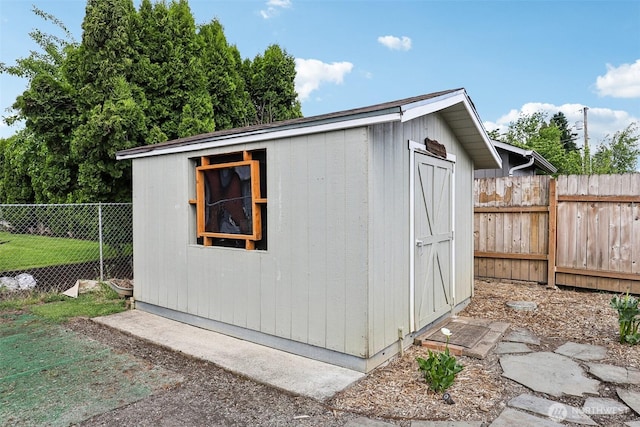 view of shed featuring a fenced backyard