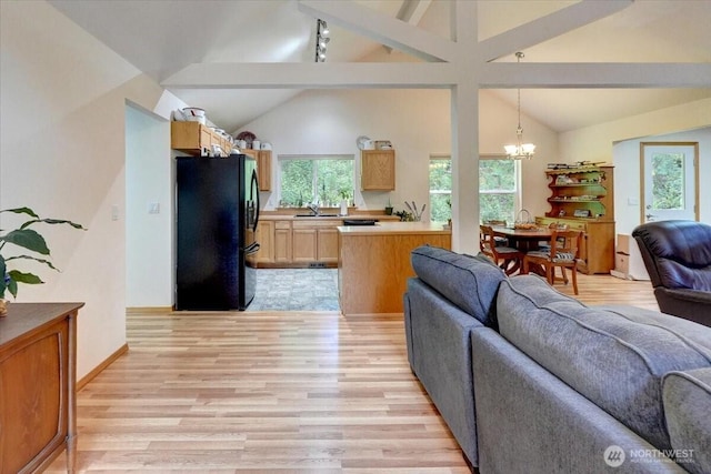 9535 Olalla Valley Rd SE, Port Orchard, WA 98367 - living area with light wood-type flooring, a chandelier, beamed ceiling, and high vaulted ceiling
