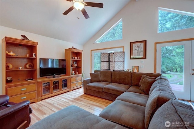 9535 Olalla Valley Rd SE, Port Orchard, WA 98367 - living room featuring high vaulted ceiling, a ceiling fan, and wood finished floors