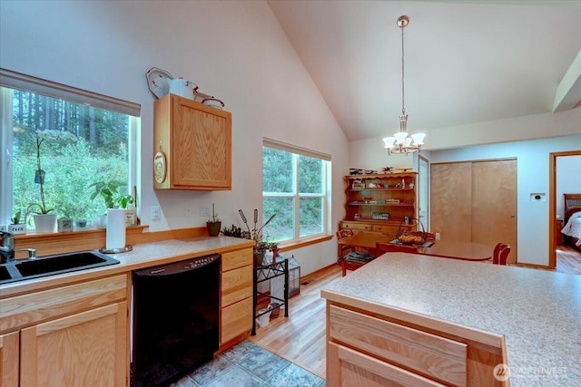 9535 Olalla Valley Rd SE, Port Orchard, WA 98367 - kitchen featuring black dishwasher, a sink, light countertops, a chandelier, and high vaulted ceiling