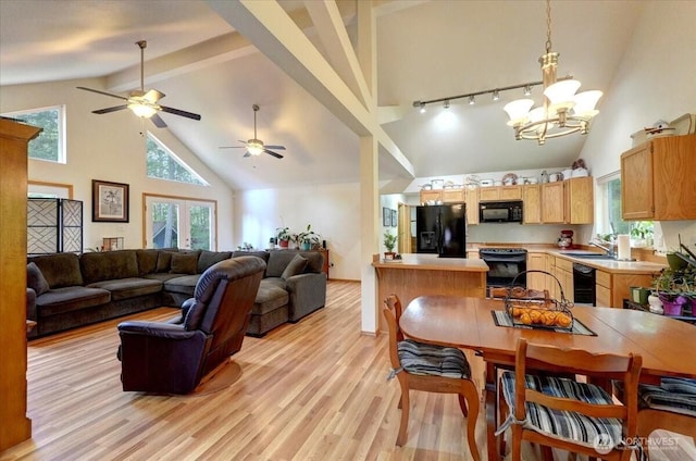 9535 Olalla Valley Rd SE, Port Orchard, WA 98367 - dining area with high vaulted ceiling, light wood finished floors, beamed ceiling, a chandelier, and a ceiling fan