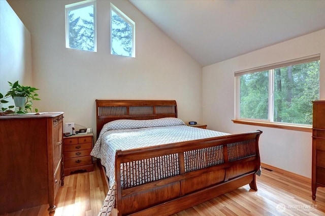 9535 Olalla Valley Rd SE, Port Orchard, WA 98367 - bedroom with light wood-style flooring, lofted ceiling, and baseboards