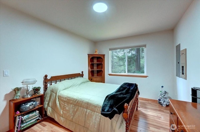 9535 Olalla Valley Rd SE, Port Orchard, WA 98367 - bedroom with light wood finished floors, electric panel, and baseboards