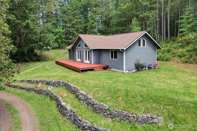 9535 Olalla Valley Rd SE, Port Orchard, WA 98367 - view of front facade with a wooden deck, a front yard, a wooded view, and roof with shingles