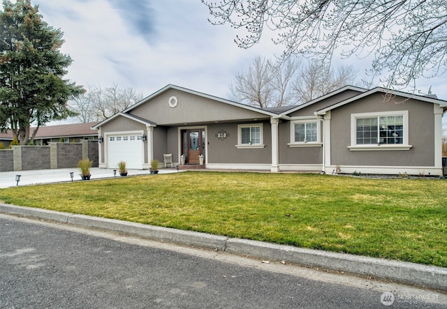 515 N Shelley Ave, Othello, WA 99344 - ranch-style home featuring a garage, stucco siding, and concrete driveway