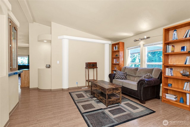 178 Bear View Dr, Chehalis, WA 98532 - living area featuring lofted ceiling, wood finished floors, and baseboards