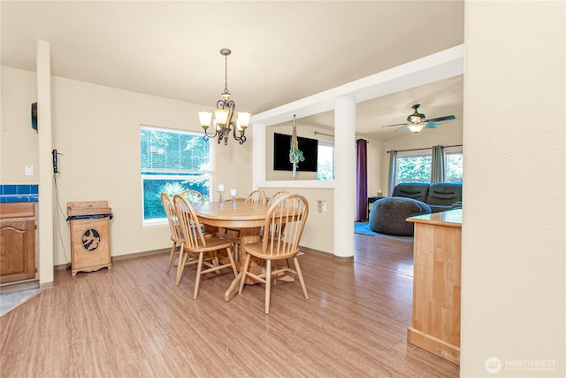 178 Bear View Dr, Chehalis, WA 98532 - dining area with light wood-style flooring, a chandelier, and ceiling fan