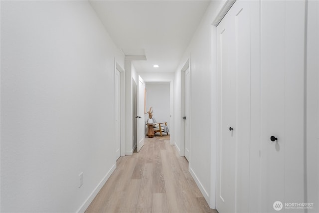22406 121st Dr NE, Arlington, WA 98223 - hallway with light wood finished floors, baseboards, and recessed lighting