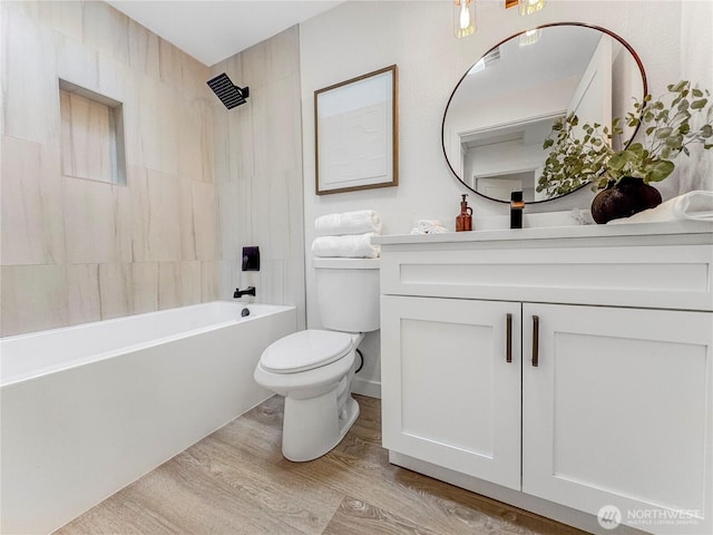 22406 121st Dr NE, Arlington, WA 98223 - full bath with toilet, wood finished floors, vanity, and shower / bathtub combination