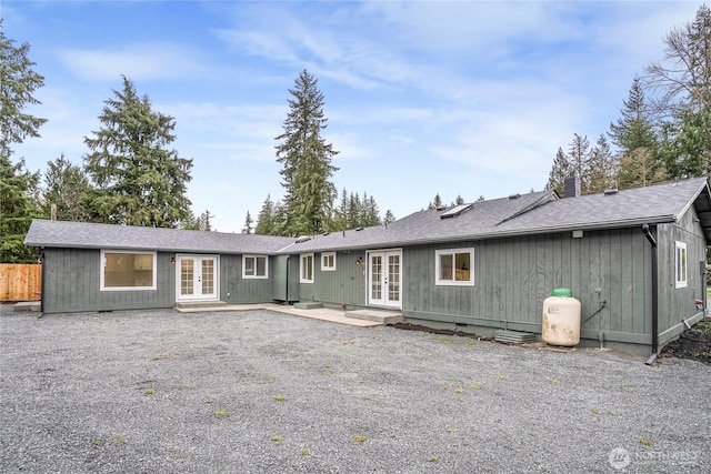 22406 121st Dr NE, Arlington, WA 98223 - rear view of property featuring french doors, a shingled roof, and a patio