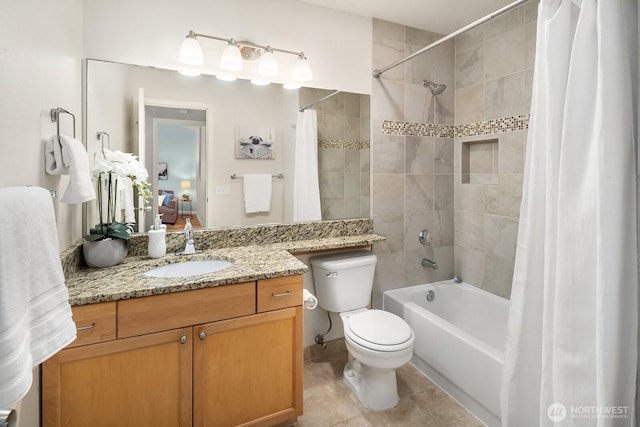 bathroom featuring shower / bath combo, tile patterned flooring, toilet, and vanity