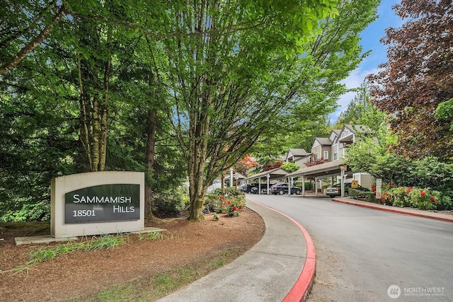 community sign featuring covered parking