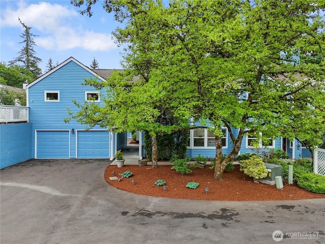 4037 220th Pl SE Unit 1105, Issaquah, WA 98029 - obstructed view of property with driveway and an attached garage