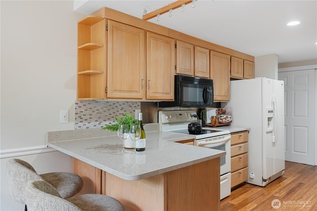 4037 220th Pl SE Unit 1105, Issaquah, WA 98029 - kitchen featuring white appliances, open shelves, a peninsula, a breakfast bar, and tasteful backsplash