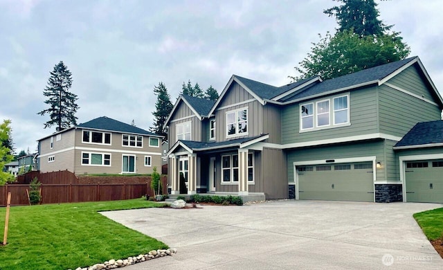 13225 164th Ave SE Unit 203, Renton, WA 98059 - craftsman-style home with covered porch, board and batten siding, an attached garage, and driveway