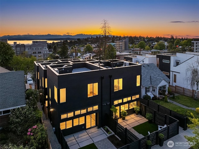 modern home featuring fence