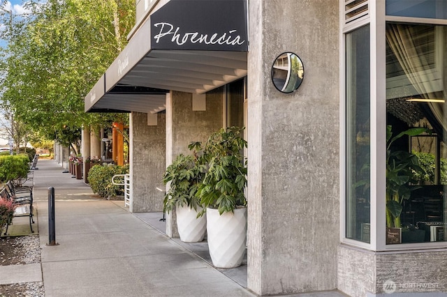 doorway to property with stucco siding