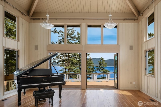871 Deer Point Rd, Orcas Island, WA 98279 - living area with beam ceiling, wood ceiling, hardwood / wood-style floors, plenty of natural light, and a towering ceiling