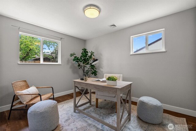 home office featuring baseboards and wood finished floors