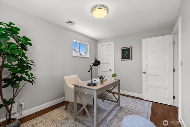 office with baseboards and wood finished floors