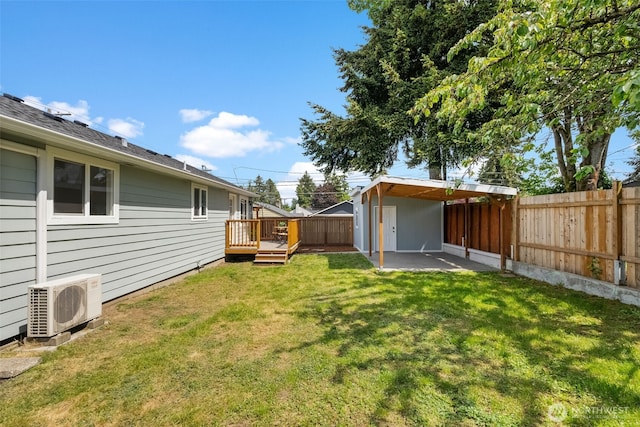 view of yard featuring ac unit, a wooden deck, and a patio area