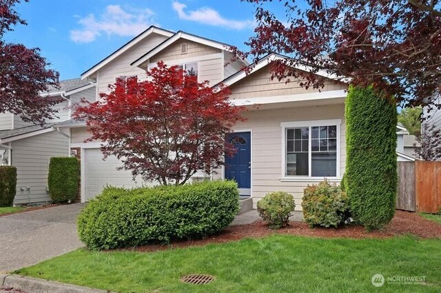 18631 10th Ave SE, Bothell, WA 98012 - obstructed view of property featuring a garage and driveway