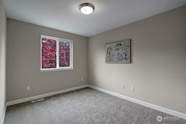 18631 10th Ave SE, Bothell, WA 98012 - empty room with baseboards and carpet