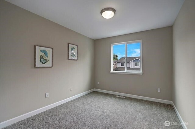 18631 10th Ave SE, Bothell, WA 98012 - spare room with carpet and baseboards