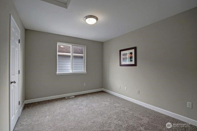 18631 10th Ave SE, Bothell, WA 98012 - empty room with carpet flooring and baseboards