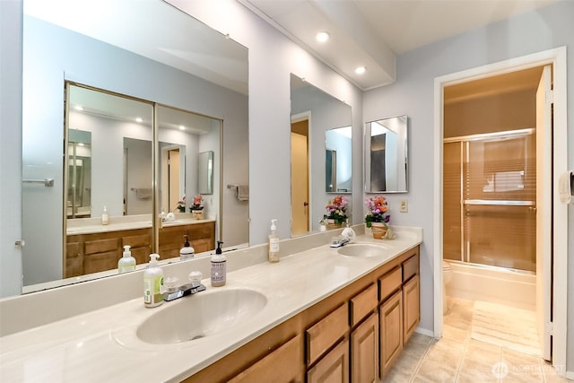 8408 18th Ave W Unit 10-202, Everett, WA 98204 - bathroom featuring toilet, double vanity, recessed lighting, and tile patterned flooring