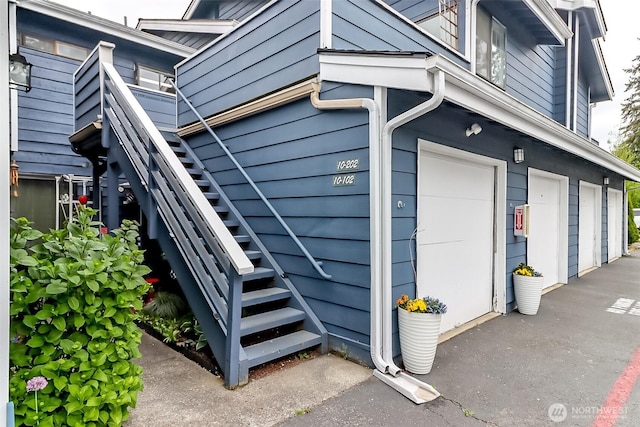 8408 18th Ave W Unit 10-202, Everett, WA 98204 - view of property exterior with stairs and a garage