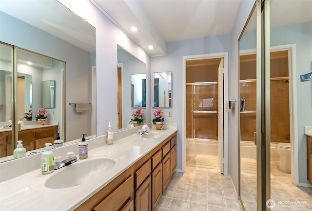 8408 18th Ave W Unit 10-202, Everett, WA 98204 - full bathroom with toilet, a shower with door, double vanity, and recessed lighting