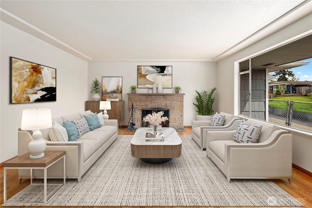 1113 S 72nd St, Tacoma, WA 98408 - living room featuring wood finished floors, a fireplace, and baseboards