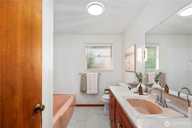 1113 S 72nd St, Tacoma, WA 98408 - bathroom with healthy amount of natural light, toilet, tile patterned flooring, and vanity