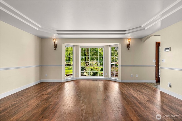 2060 5th St, Wenatchee, WA 98801 - spare room featuring a tray ceiling, wood-type flooring, arched walkways, and baseboards