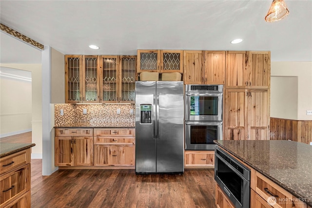 2060 5th St, Wenatchee, WA 98801 - kitchen with appliances with stainless steel finishes, dark stone counters, glass insert cabinets, recessed lighting, and dark wood-style flooring
