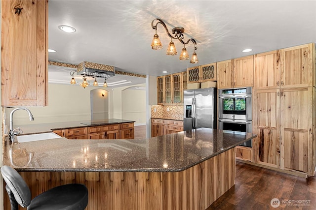 2060 5th St, Wenatchee, WA 98801 - kitchen featuring appliances with stainless steel finishes, a sink, a peninsula, recessed lighting, and dark wood finished floors