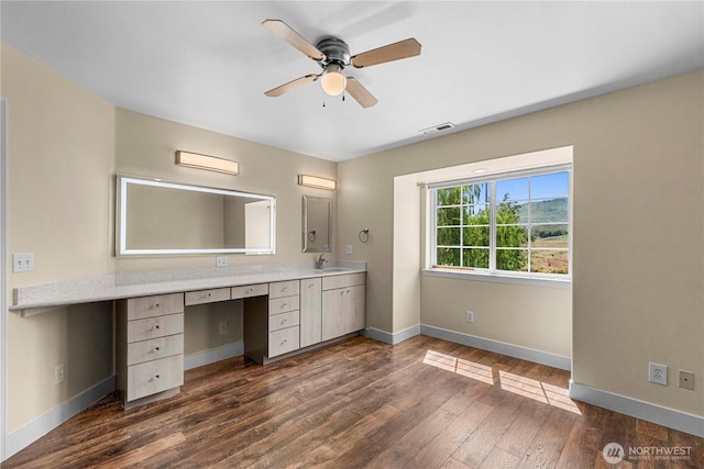 2060 5th St, Wenatchee, WA 98801 - bathroom featuring wood finished floors, baseboards, ceiling fan, and double vanity