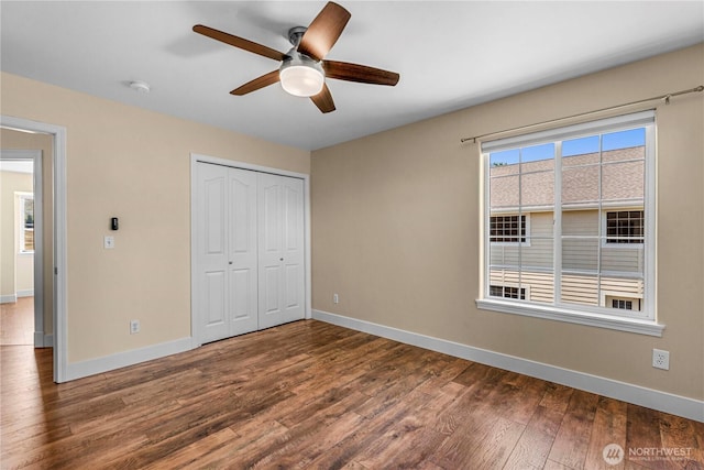 2060 5th St, Wenatchee, WA 98801 - unfurnished bedroom with wood finished floors, baseboards, a closet, and a ceiling fan