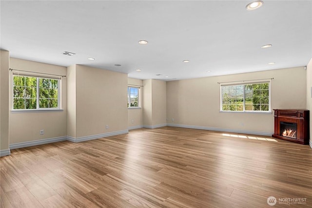 2060 5th St, Wenatchee, WA 98801 - unfurnished living room featuring healthy amount of natural light, light wood finished floors, baseboards, and recessed lighting