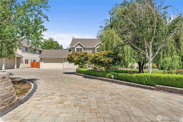 2060 5th St, Wenatchee, WA 98801 - view of property hidden behind natural elements featuring decorative driveway and a garage