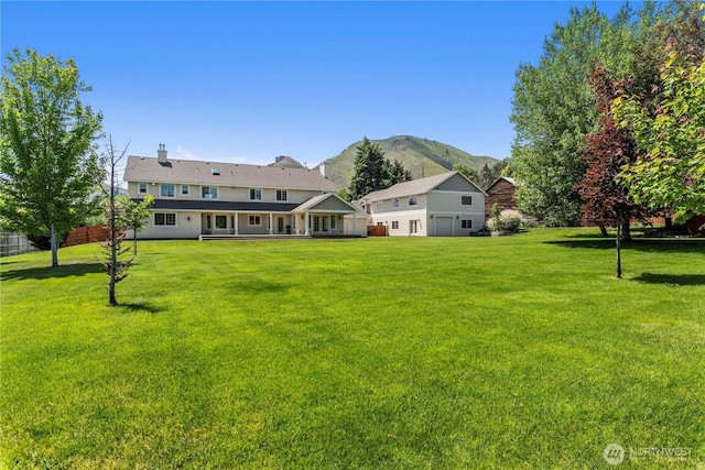 2060 5th St, Wenatchee, WA 98801 - view of green lawn featuring a mountain view and a garage