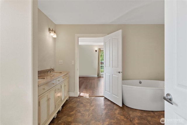 2060 5th St, Wenatchee, WA 98801 - full bathroom featuring a soaking tub, double vanity, and baseboards