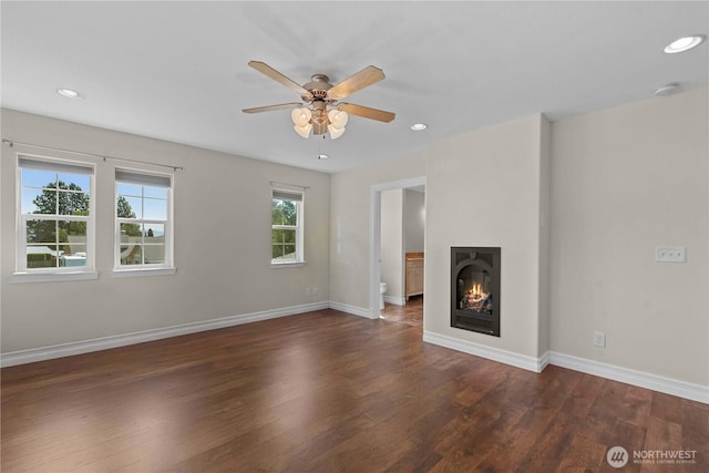 2060 5th St, Wenatchee, WA 98801 - unfurnished living room with a ceiling fan, wood finished floors, recessed lighting, baseboards, and a glass covered fireplace