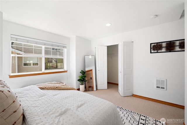 1123 N 94th St Unit A, Seattle, WA 98103 - bedroom with light carpet, baseboards, and a closet