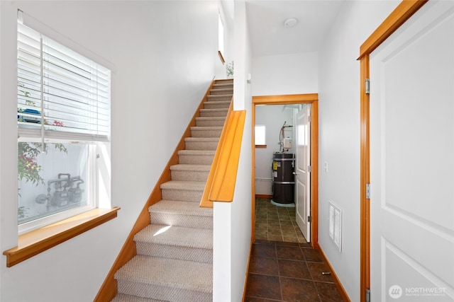 1123 N 94th St Unit A, Seattle, WA 98103 - stairs featuring healthy amount of natural light and water heater