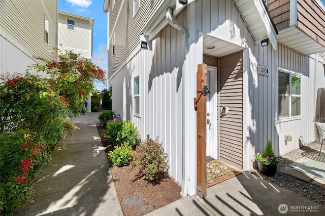 1123 N 94th St Unit A, Seattle, WA 98103 - view of exterior entry with board and batten siding