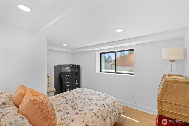 bedroom with wood finished floors, recessed lighting, and baseboards